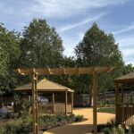 A photo of wooden shelters in school garden